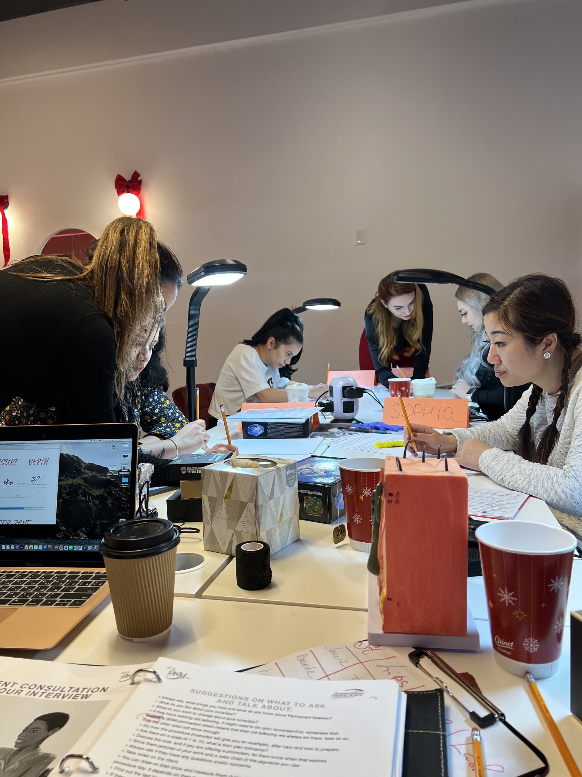 Students practicing together at a class table