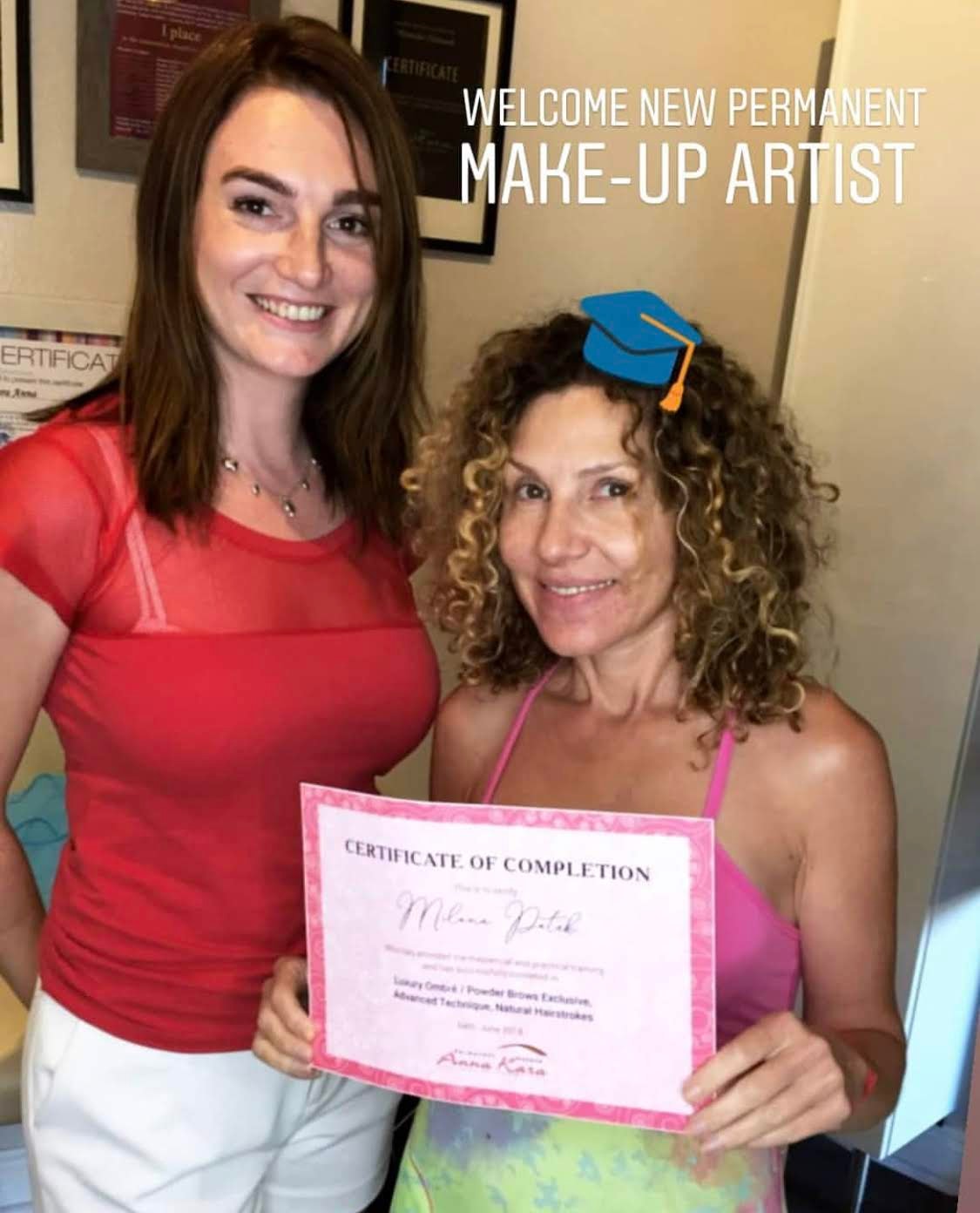 Anna handing a certificate to a student in La Jolla