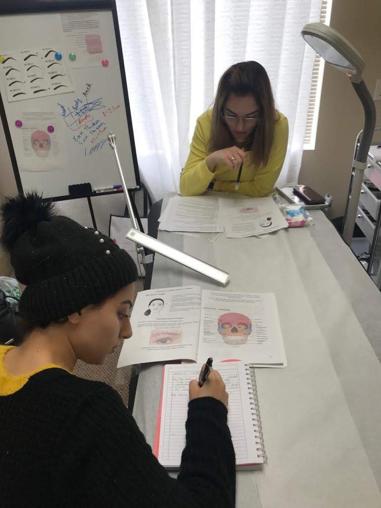 A student taking notes during a lesson in La Jolla